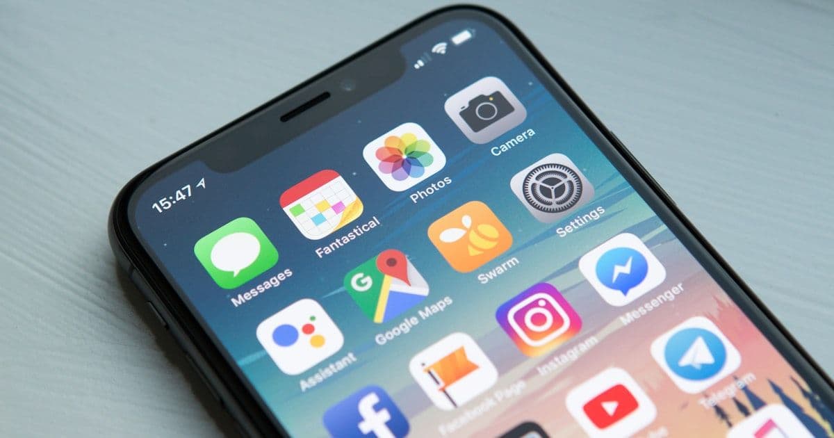 Person using smartphone to search for local businesses on Google Maps in Massachusetts